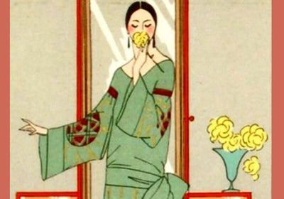 Elegant woman in traditional attire enjoying flowers, representing the essence of Mystery in the Air fragrance oil blend.