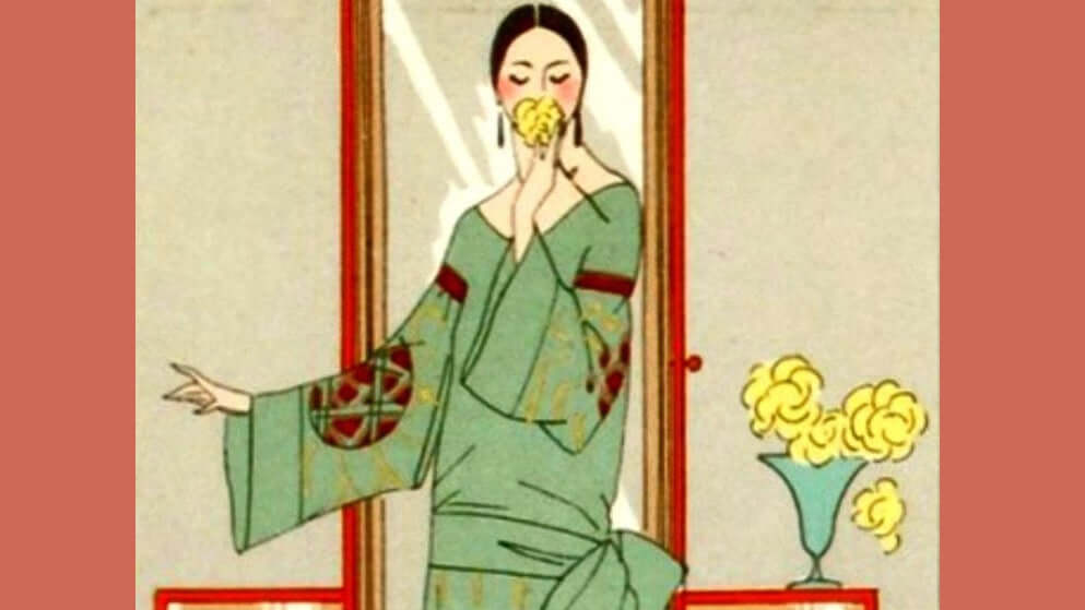 Elegant woman in traditional attire enjoying flowers, representing the essence of Mystery in the Air fragrance oil blend.